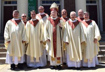 Father John Rother, front second from left, joins Bishop Cullen, front center, and concelebrants after his ordination. From left are: front, Father Bernard Taglianetti, professor at St. Charles Borromeo Seminary, Philadelphia; Father William Linkchorst; Msgr Alfred Schlert, diocesan administrator; back; Msgr. Francis Schoenauer, cathedral pastor; Msgr. Gerald Gobitas, diocesan chancellor and Secretary for Clergy; Father John Pendzick, pastor of St. Elizabeth of Hungary, Whitehall; and Msgr. David James, dir