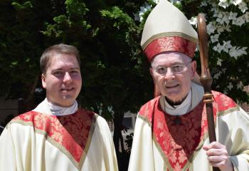 Father Rother, left, with Bishop Cullen after his ordination. (Photo by John Simitz)