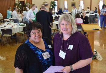 Joan Zawisza, left and Susan Teaford meet before sharing individual witness talks. (Photo by John Simitz)