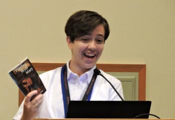 IHM postulant Beth Bartholomew speaks about praying with the book “Praying with Mary” by Msgr. David Rosage during the July 18 Fiat morning presentation. (Photo by Tami Quigley)