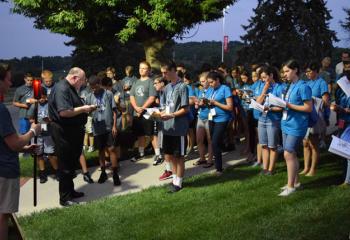 Msgr. David James leads the July 19 outdoor Stations of the Cross. (Photo by John Simitz)