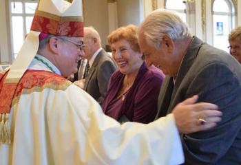 Bishop of Allentown Alfred Schlert, left, congratulates Justine and Andrew Wesnak for celebrating 60 years of marriage. 