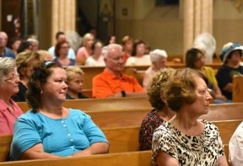 Faithful from Carbon County listen to Bishop Alfred Schlert’s homily. 