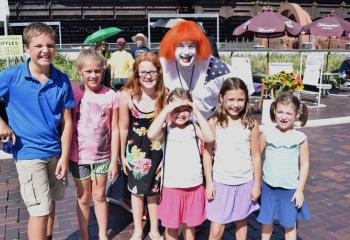 Andy the Clown poses with children. (Photo by John Simitz)