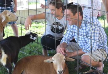 Donna and Kevin Montone check out the petting zoo. (Photo by John Simitz)
