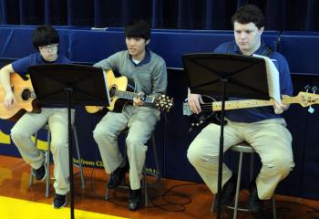 Guitarists of Notre Dame’s Music Ministry are, from left, Yunji Sun, Dongseop Lee and Chris Bianchi. (Photo by Ed Koskey)