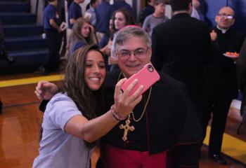 A student takes a selfie with Bishop Schlert. (contributed photo)