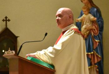 Msgr. Daniel Yenushosky thanks Bishop Schlert for his presence with the faithful that evening.