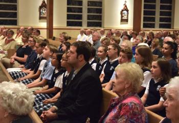 Clergy, laity and students participate at the Mass.