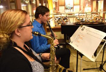 Musicians, Sarah Wascavage and Ben Miller, parishioners of St. Francis of Assisi, enhance the music for the Mass.