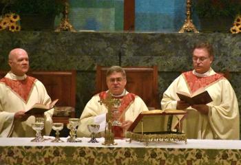 Bishop Alfred Schlert, center, celebrates a special Lehigh Deanery Mass. Concelebrating with the Bishop are, from left, Msgr. Daniel Yenushosky, pastor of Holy Trinity, Whitehall and vicar forane of the Lehigh Deanery; and Msgr. Victor Finelli, pastor of St. Francis of Assisi. 