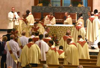 Priests receiving communion.