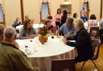 Guests enjoy wine and cheese at the evening sponsored by the Office of Adult Formation.