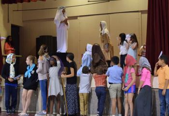 Children re-enact one of the apparitions at Fatima at St. Elizabeth.