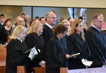 Judges attend the noon liturgy, from left: front, Judge Eleni Dimitriou Geishauser, Judge M. Theresa Johnson and Judge Emil Giordano; back, Magisterial District Judge Gail Greth, Judge Madelyn Fudeman, Bankruptcy Judge Richard Fehling and Judge Thomas Parisi.