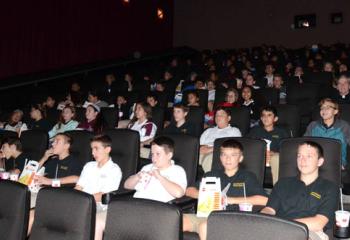 Movie snacks in hand, students of Good Shepherd Catholic School, Northampton are ready for the movie to begin.