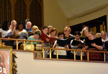 The parish choir sings during the Mass.