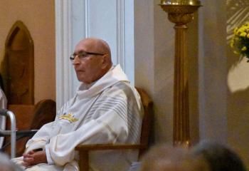 Father Dominik Kalata concelebrates Mass at St. John the Baptist in observance of the parish renewal year he initiated.