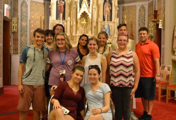 Teens from Our Lady of Mount Carmel and Queenship of Mary gather for a group photo with their youth ministers. (Photo by Alexa Doncsecz)