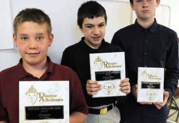 Eighth-grade winners of the spelling bee are, from left: champion Liam Skopal, St. Theresa School, Hellertown; Dominic Chewey, St. Michael the Archangel School, Bethlehem-Coopersburg, second place; and Jacob Challenger, St. Ambrose School, Schuylkill Haven, third place. 