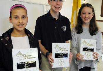 Seventh-grade winners of the spelling bee are, from left: champion Ella Laski, St. Michael the Archangel School; Christian Fragassi, St. Joseph the Worker School, Orefield, second place; and Julia Pohl, Our Lady of Perpetual Help School, Bethlehem, third place.