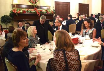 Bishop Alfred Schlert greets Legatus members and guests after dinner.