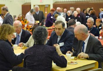 Retired Judge William Ford, right and George Kinek partake in light refreshments with other stewards after Evening Prayer. There are four circles in the Council of Stewards: Circle of Faith, $500-$999; Circle of Hope, $1,000-$2,499; Circle of Charity, $2,500-$4,999; and Bishop’s Circle, $5,000 and over.
