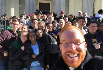 Father Mark Searles, front right, and Allentown Central Catholic High School (ACCHS) students show their pro-life enthusiasm outside the Basilica. (Photo courtesy of Father Mark Searles)