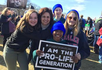Declaring “I Am the Pro-Life Generation” are members of the Assumption BVM group, from left, Jessica Krafczyk, Jill Krafczyk, Jeremy Sumner, John Paul Krafczyk and Tessa Temple. (Photo courtesy of Lisa Temple)