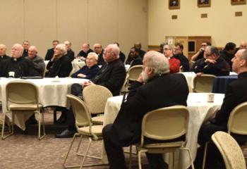 Priests gather for the daylong event.
