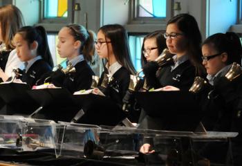 Members of the hand bell choir at Our Lady of Perpetual Help School, Bethlehem performing a musical selection during Mass are, from left, Aiyan Elias, Mary Jo Rutkowski, Ryanna Kral, Tenley Irr, Anna Echevarria, Grace Hartman, Elizabeth Stawicki, Emma Zambo, Katy Stawicki, Maelle Pierre and Julia Pohl. (Photo by Ed Koskey)