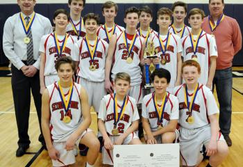St. Thomas More is the grade school boys’ champion. From left are: front, Jake Seed, Jacksen Jobes, Patrick Bova and Nate Mullaney; second row, Aidan Wakstein, Ben Scandone, Brendan Boyle, Kyle Hodrick and Michael Driscoll; back, head coach Dave Gehris, Liiam Joyce, Brandon Quinn, Alistair Stewart-Smith, Griff Patridge and coach Kevin Hodrick.
