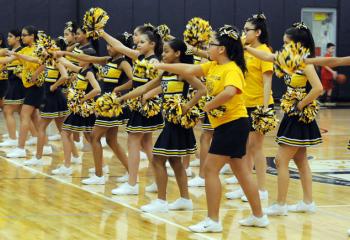 St. Peter’s cheerleaders cheer on the guys during the grade school boys’ semi-finals March 4.