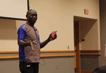 Thomas Awiapo tells how he overcame his struggle for survival thanks to CRS Rice Bowl during a talk Feb. 21 at DeSales University, Center Valley. (Photo courtesy of Robert Olney)