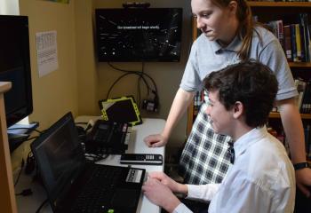 At the controls for the media center are Samantha Loeper and Jacob Demchak.