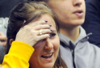 Melanie Markulics watches her son, Richie Markulics, NDHS, wrestle for and win third place 3-2 during the 120-pound bout.  