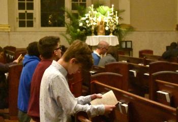 Faithful engage in prayer while visiting the Cathedral of St. Catharine of Siena, Allentown as one the church visitations on Holy Thursday, March 29.