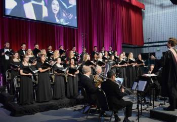 The DeSales University Chorale performs a song during the inauguration ceremony in Billera Hall. 