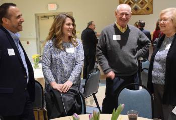 Chatting are, from left, Peter and Sally Murgia, parishioners of St. Rocco, and Michael and Terri O’Connell, parishioners of Sacred Heart, Bethlehem.