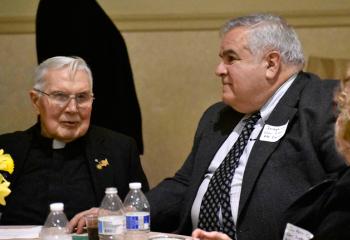 Congregation of the Missions (Vincentians Fathers, C.M.) Father James Prior, pastor of Our Lady of Mount Carmel, Roseto, talks with Joseph Coccia, parishioner of Our Lady of Mount Carmel.