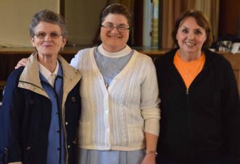 Reconnecting before the talk begins are, from left, Sister Mary Glackin, Sister Emily Vincent and Helen Weiss, parishioner of St. Patrick, Pottsville.