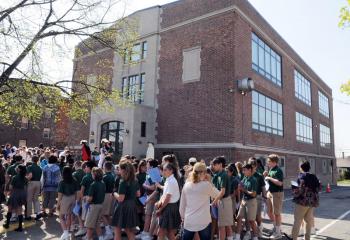 Students, staff and faithful leave the Bennett Building after crowning the Blessed Mother and blessing of $1.3 million in renovations.