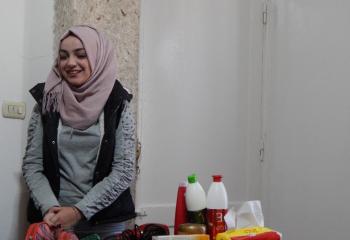 Rahaf Alshawi, a single 21-year-old Syrian woman who was able to start her own hairdressing salon with a grant through the Livelihoods Services Initiative. She supports a family of five – her mother, a father in poor health and two younger brothers.