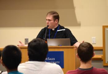 Deacon Zachary Wehr speaks to Quo Vadis and Fiat Days participants.