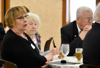 Members of the Legacy Society listen to remarks at a luncheon honoring their generosity. 