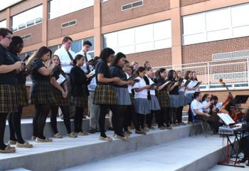 The Berks Catholic Honors Choir sings during the ceremony.