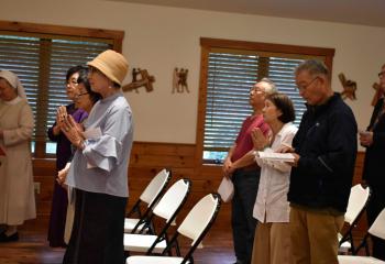 Those gathered participate in the afternoon liturgy.
