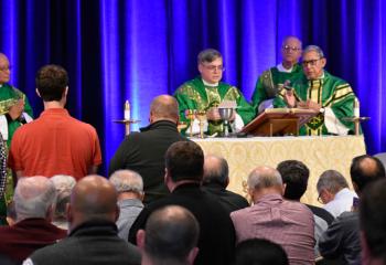 Bishop of Allentown Alfred Schlert, center, celebrates Mass at the Diocesan Men’s Conference. From left are: Deacon Hernandez; Deacon Michael Doncsecz, assigned to Queenship of Mary, Northampton; and Bishop Cisneros.