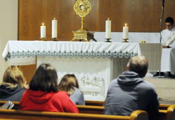 Faithful meditate during the Holy Hour at St. Catharine of Siena, Reading. (Photo by Ed Koskey)