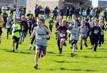 Theo Wechtler, St. Michael the Archangel School, Coopersburg, leads the pack before clinching first place for the kindergarten, first- and second-grade boys’ race. Wechtler’s time helped St. Michael capture first place in the boys’ race.
